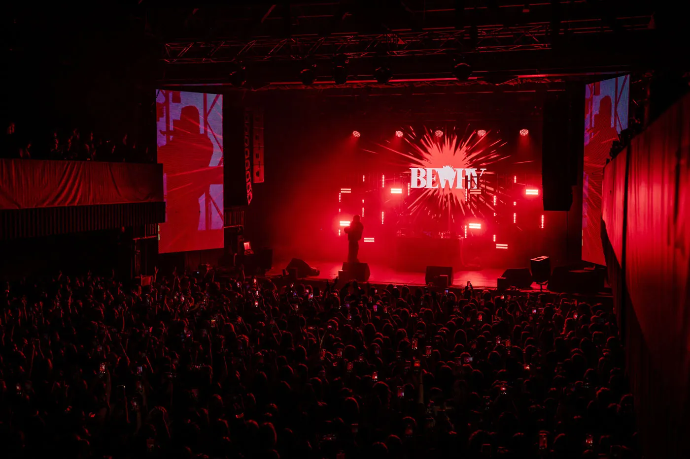 Crowd filling an arena during a TAPE Agency tour show